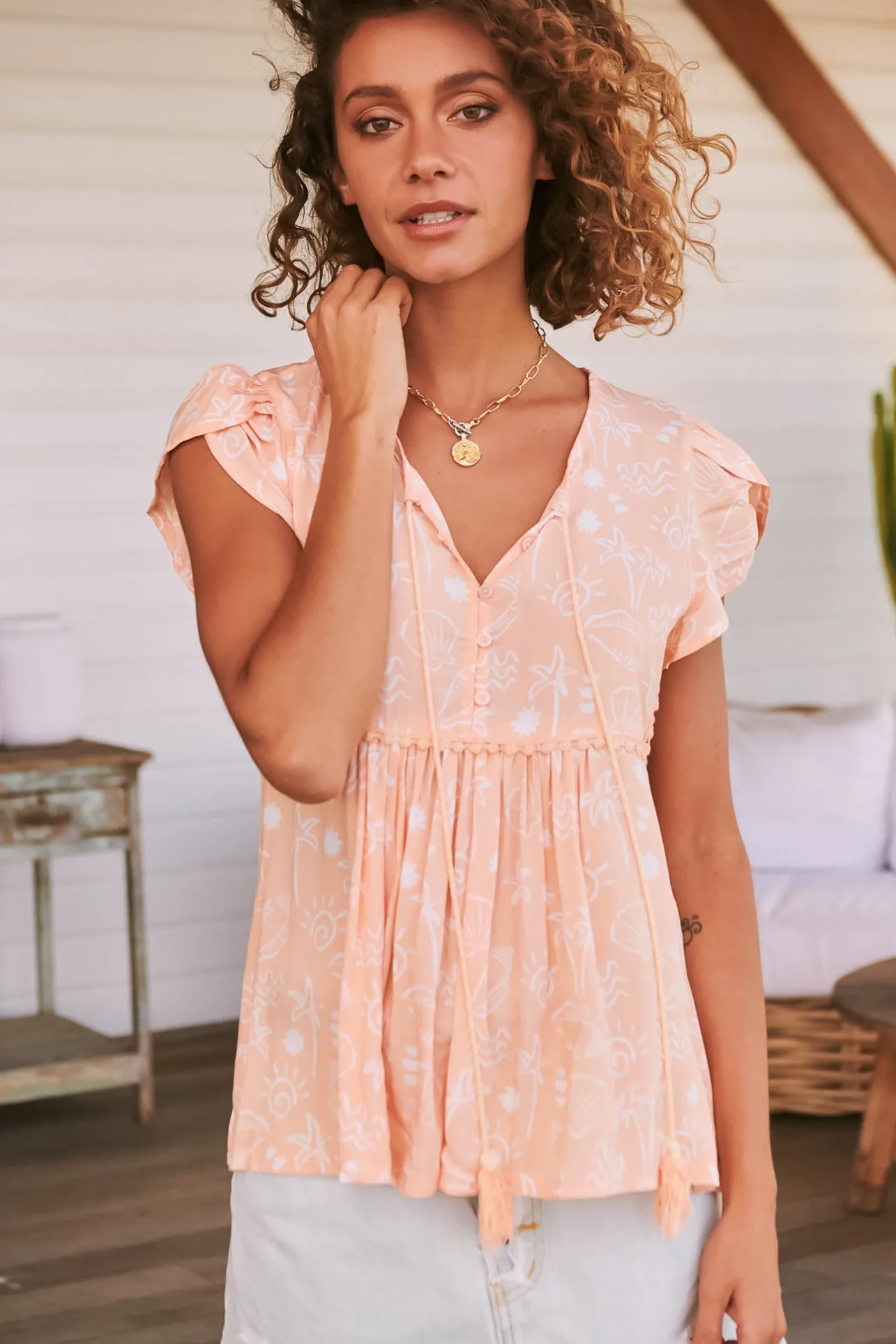 - Ella Top: Butterfly Cap Sleeve Smock Top with Neck Tie in Peach Island Print>Jaase Outlet