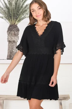 Leelie Mini Dress - Lace Embellished Tiered Dress with Bell Sleeves in Black><noscript><img width=