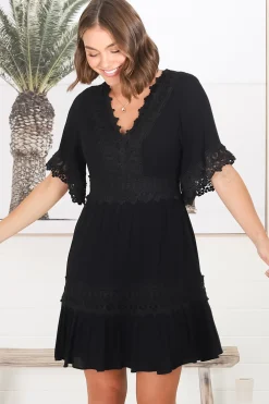 Leelie Mini Dress - Lace Embellished Tiered Dress with Bell Sleeves in Black><noscript><img width=