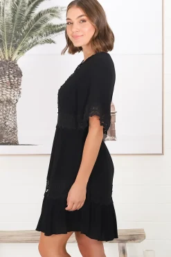 Leelie Mini Dress - Lace Embellished Tiered Dress with Bell Sleeves in Black><noscript><img width=
