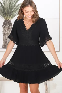 Leelie Mini Dress - Lace Embellished Tiered Dress with Bell Sleeves in Black><noscript><img width=