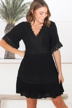 Leelie Mini Dress - Lace Embellished Tiered Dress with Bell Sleeves in Black><noscript><img width=