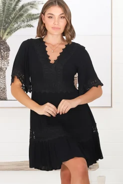 Leelie Mini Dress - Lace Embellished Tiered Dress with Bell Sleeves in Black><noscript><img width=