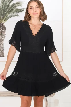 Leelie Mini Dress - Lace Embellished Tiered Dress with Bell Sleeves in Black><noscript><img width=