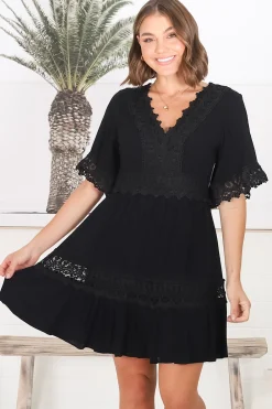 Leelie Mini Dress - Lace Embellished Tiered Dress with Bell Sleeves in Black><noscript><img width=