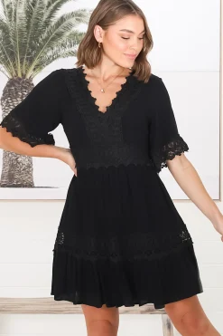 Leelie Mini Dress - Lace Embellished Tiered Dress with Bell Sleeves in Black><noscript><img width=