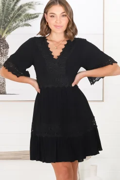 Leelie Mini Dress - Lace Embellished Tiered Dress with Bell Sleeves in Black><noscript><img width=